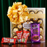 Show Your Love Combo gift hamper featuring 24-piece Ferrero Rocher box, Cadbury Silk, KitKat bars, and a golden ribbon – perfect for gifting loved ones."